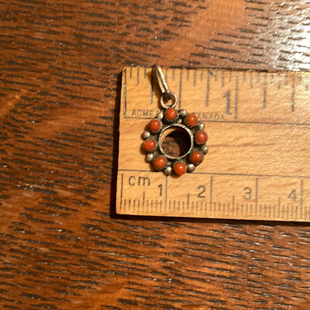 Tiny coral set Navajo made sterling silver pendant. Vintage snake eye.